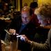 WISD Superintendent Scott Menzel gets an update on election coverage at the Tower Inn Cafe in Ypsilanti on Tuesday. Menzel is optimistic about early trends and reports. Daniel Brenner I AnnArbor.com